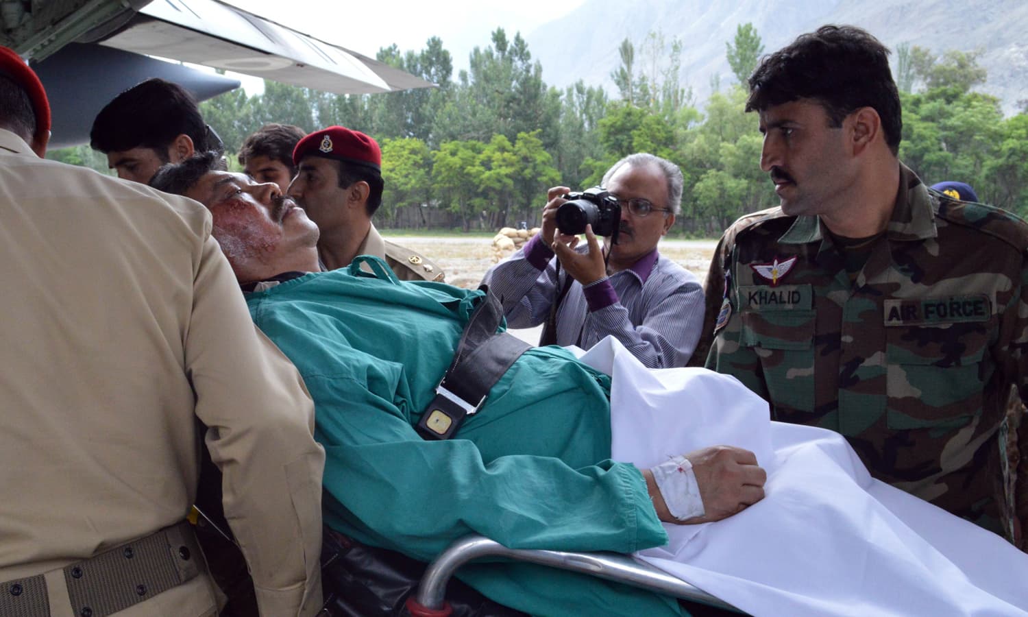 Soldiers lift injured Malaysian ambassador Hasrul Sani Mujtabar into an army helicopter in Gilgit.  &mdash; AFP