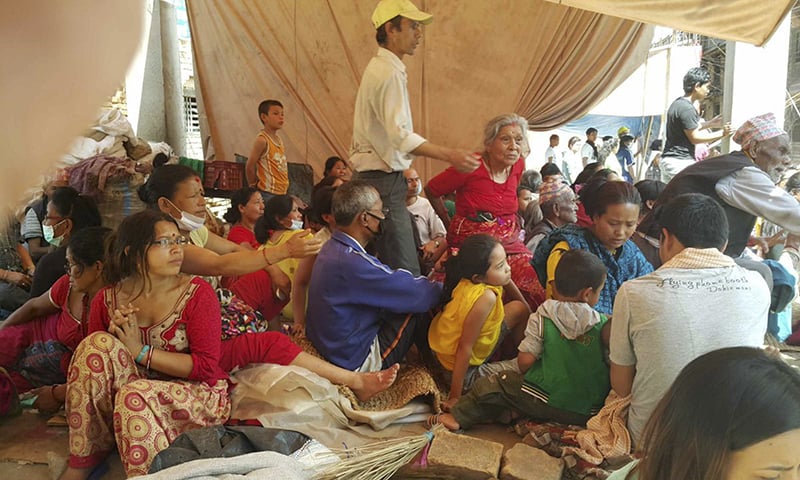 Nepalese people gather in a temporary shelter after another earthquake in Bhaktapur, Nepal, Tuesday, May 12, 2015.&mdash; AP