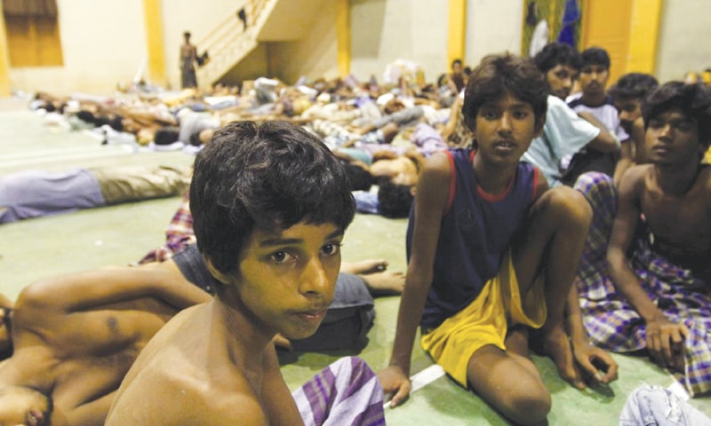 ROHINGYA migrants rest inside a shelter after being rescued by fishermen at Lhoksukon in Indonesia’s Aceh Province.—Reuters