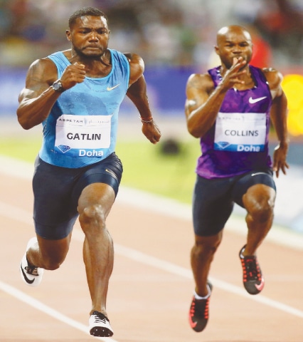 DOHA: Justin Gatlin (L) of the United States sprints to win the 100m race in the Diamond League meeting at the Suhaim bin Hamad Stadium.&mdash;AFP