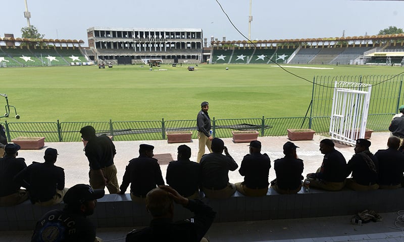 Policmen gather for a rehearsal of security arrangements for the Zimbabwe team outside the Gaddafi Stadium in Lahore. — AFP