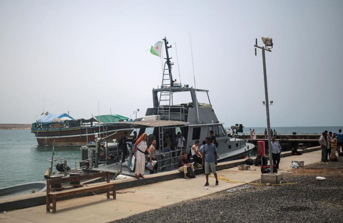 Newly-arrived Yemeni refugees wait at the Obock port in northern Djibouti —AP