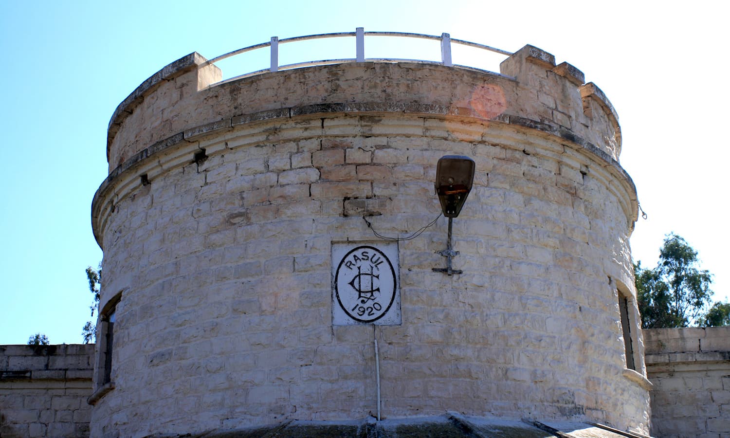 The emblem on the wall of the roof, which reads “Rasul 1920”.