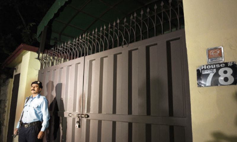 A policeman stands guard outside Save the Children office in Islamabad.- File Photo