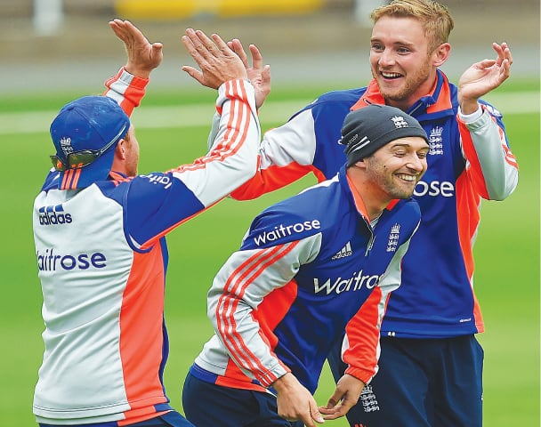 BIRMINGHAM: (L to R) England cricketers Ian Bell, Mark Wood and Stuart Broad enjoy a light moment during a training session at Edgbaston on Tuesday.&mdash;AFP