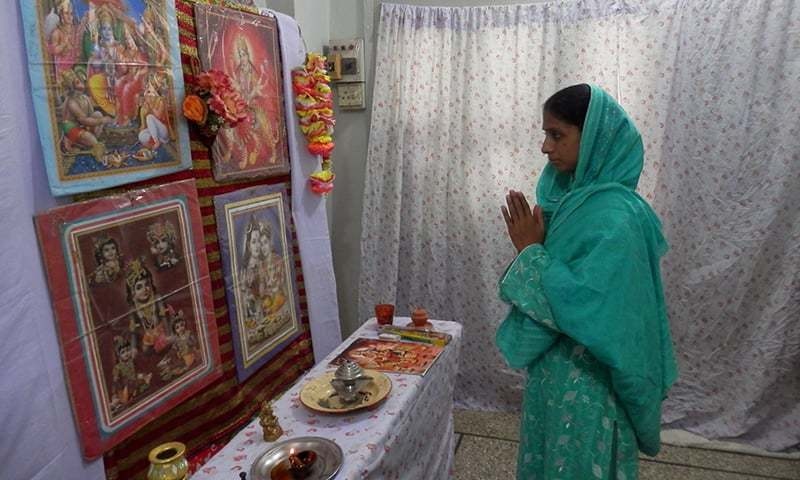 Geeta performing puja in the temple-room. —Akhtar Balouch