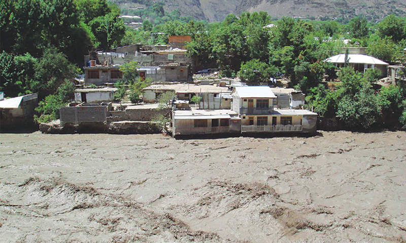 Heavy flood water flowing into the river