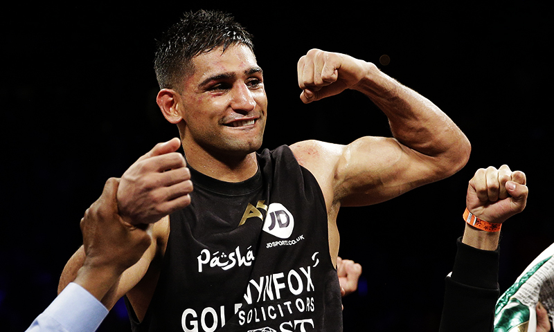 In this photo, Amir Khan celebrates after defeating Devon Alexander in their welterweight bout, December 13, 2014, in Las Vegas. — AP/File