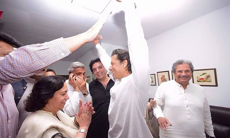 Imran Khan gestures alongside party members after a tribunal deseated Ayaz Sadiq as MNA. – courtesy PTI Facebook page