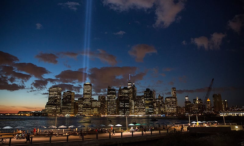 The September 11 Tribute in Light rises from the New York City skyline as seen from the Brooklyn Heights neighbourhood of the Brooklyn Borough of New York City on September 11, 2015. — AFP