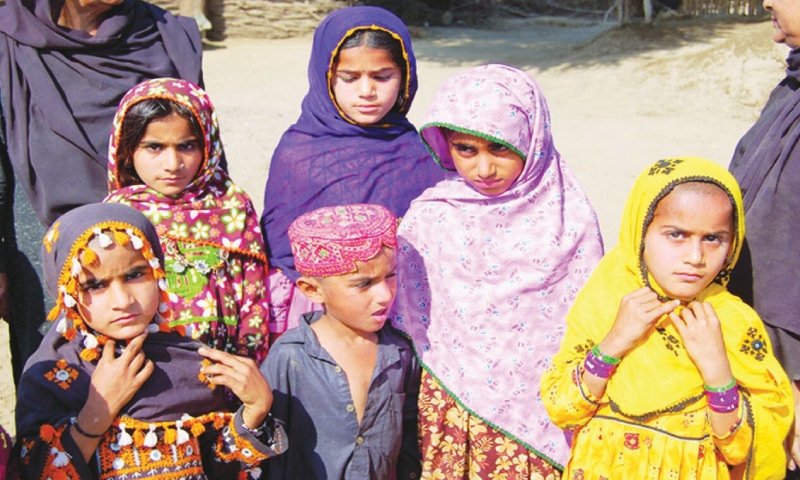 Sukkur, 2006: A group of children gathered by the police after a raid on a village in the katcha area of Pano Akil. Police officials took photos of the children to show them to the father of Fazila Sarki for identification. Fazila was kidnapped three years ago.&mdash;Dawn