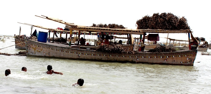 The boat people wade to get from one boat to another if the distance is negligible; otherwise their means of transport is small wooden boats (like punts) that they themselves navigate with the help of a punter.