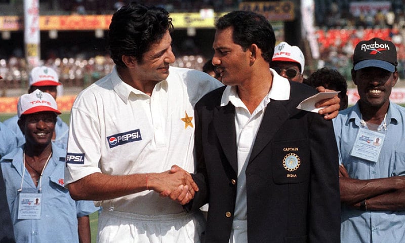 Rival captains Wasim Akram and Mohammad Azharuddin shake hands at the toss, India v Pakistan, 1st Test, Chennai, 1st day, January 28, 1999. —AFP