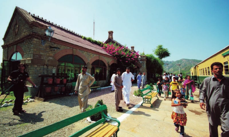 Tourists arrive at Attock Khurd railway station. — Dawn