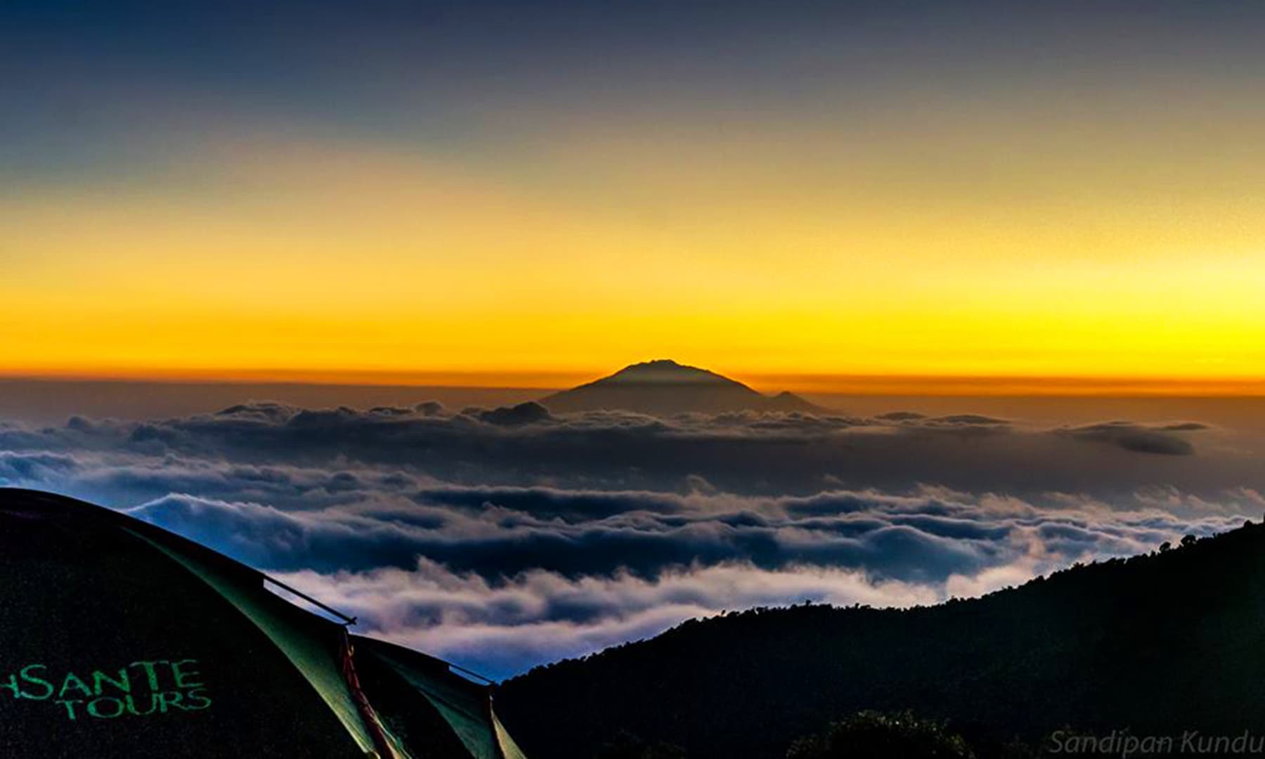 Sunset above the clouds. —Photo by Sandipan.