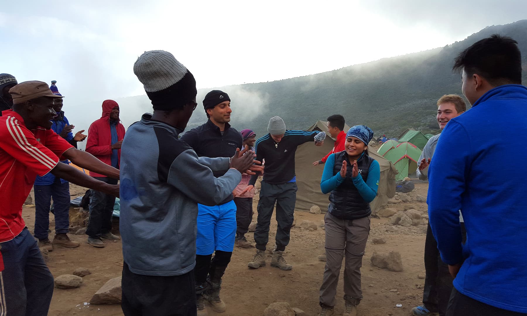 Campsite song and dance with the porters and the rest of the crew.