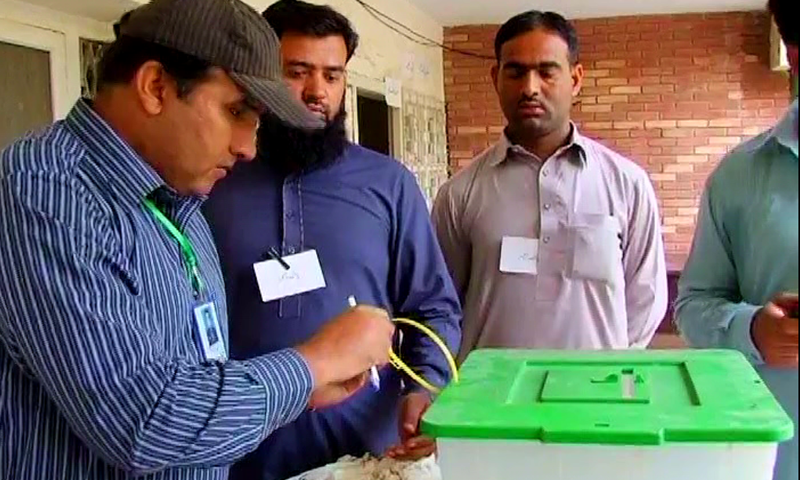 Voting under way in Okara's NA-144 constituency. ─ DawnNews screengrab.