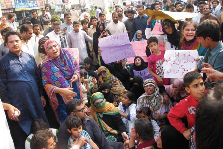 Traders from Sarafa Bazaar and their families protest in Rawalpindi on Monday. &mdash; Online