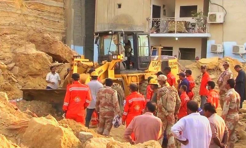 Rescue teams undertaking rescue operations at the site of the rockslide. ─ DawnNews screengrab.