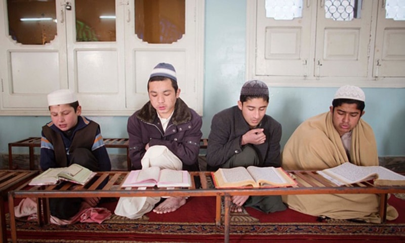 Students of the Jamia Gasmia, a militant religious school in Dhodhdr. — Photo courtesy: The Guardian