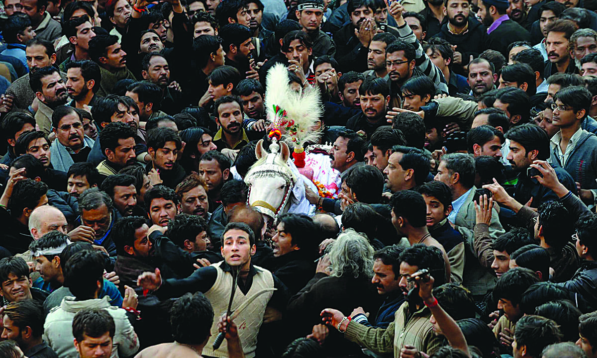 Mourners at a Muharram procession near Nisar Haveli, Lahore | M Arif, White Star