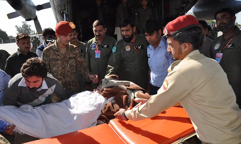 Injured are shifted to an army aircraft for further treatment at CMH. -Photo courtesy Pakistan Army