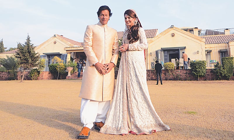 this handout photograph released by the Pakistan Tehreek-i-Insaf on Jan 8, 2015, shows Imran Khan and Reham Khan posing for a photograph at their wedding ceremony in Islamabad.—AFP