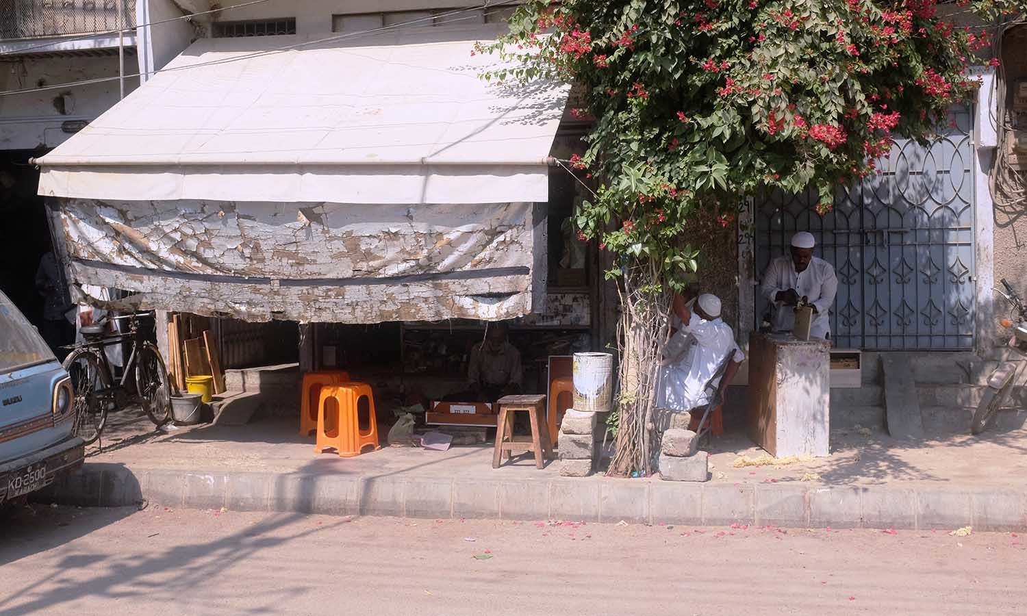 Waheed's music shop is tucked between a house and welding shop.