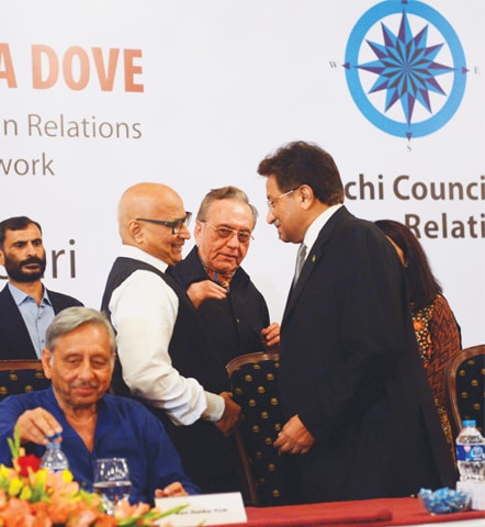 KARACHI: Sudheendra Kulkarni, who was attacked by Shiv Sena for organising the launch of Khurshid Mahmud Kasuri&rsquo;s book in Mumbai last month, meets former president Pervez Musharraf at a ceremony held to launch the book here on Monday.&mdash;Fahim Siddiqi/White Star