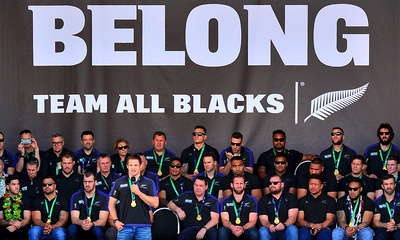 All Blacks rugby union team Captain Richie McCaw (C) speaks to the crowd as he stands in front of his team during a public event celebrating the victory by the New Zealand team at the recent Rugby World Cup. — Reuters