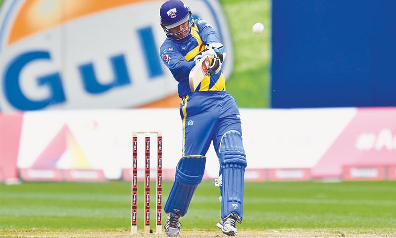 VIRENDER Sehwag of Sachin’s Blasters hits a boundary.—AFP
