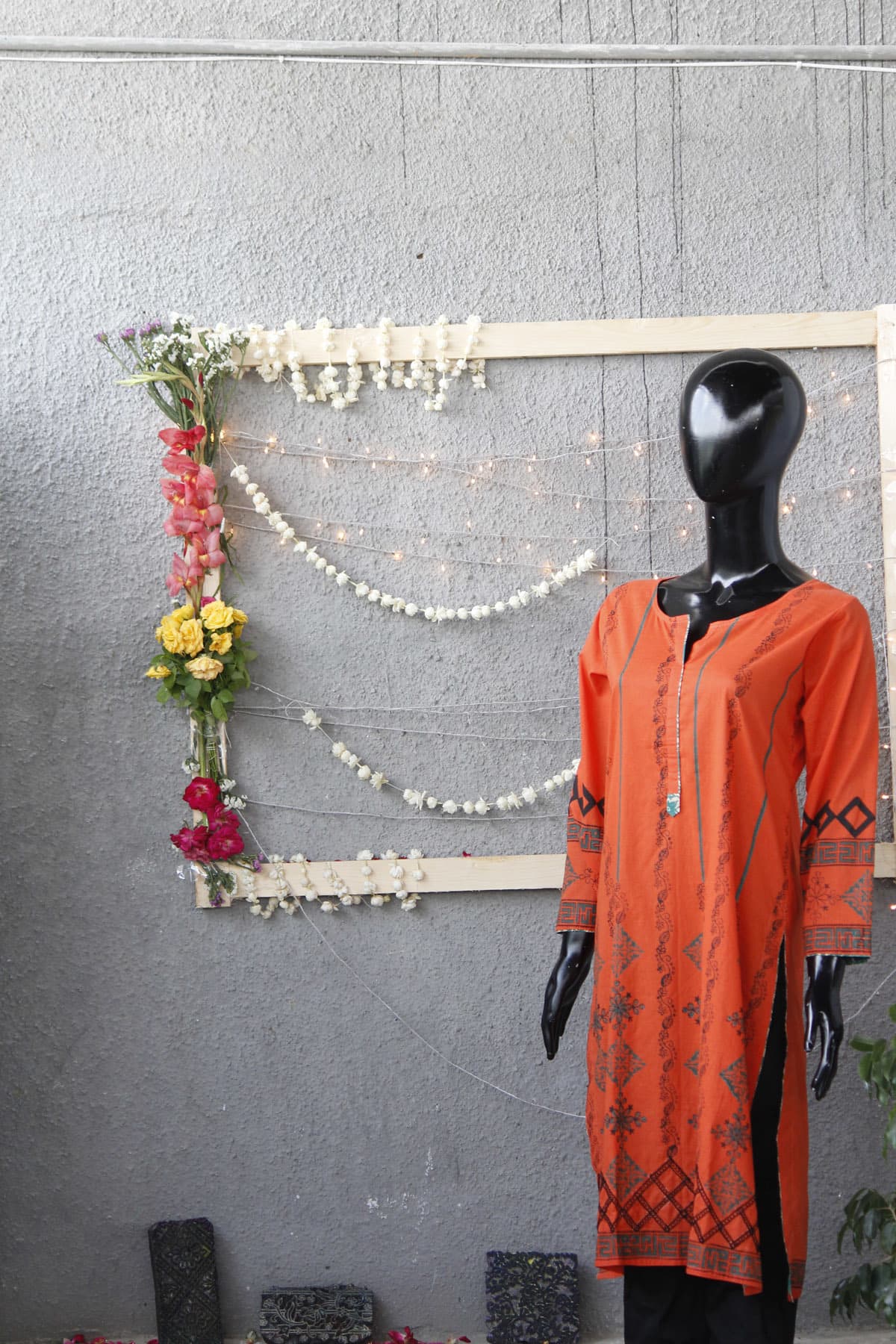 An orange stitched kurta costing Rs 3900.