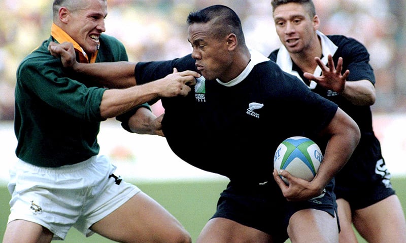 New Zealand winger Jonah Lomu attempting to push off South Africa's James Small (L) as Glen Osborne (R) runs in during the final of the 1995 Rugby World Cup at Ellis Park in Johannesburg, South Africa. &mdash; Reuters