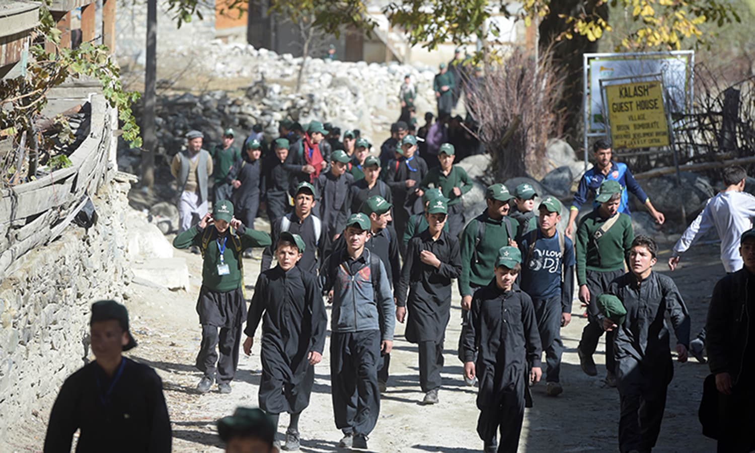 Pakistani schoolchildren return from school in the Bumburate valley. ─ AFP