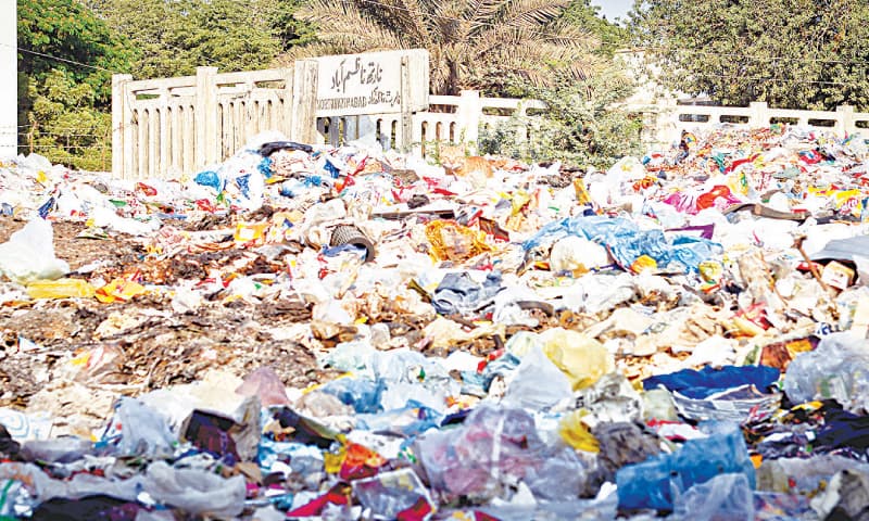 the train tracks buried under heaps of trash at the North Nazimbad Station. / Photos by Fahim Siddiqi/White Star