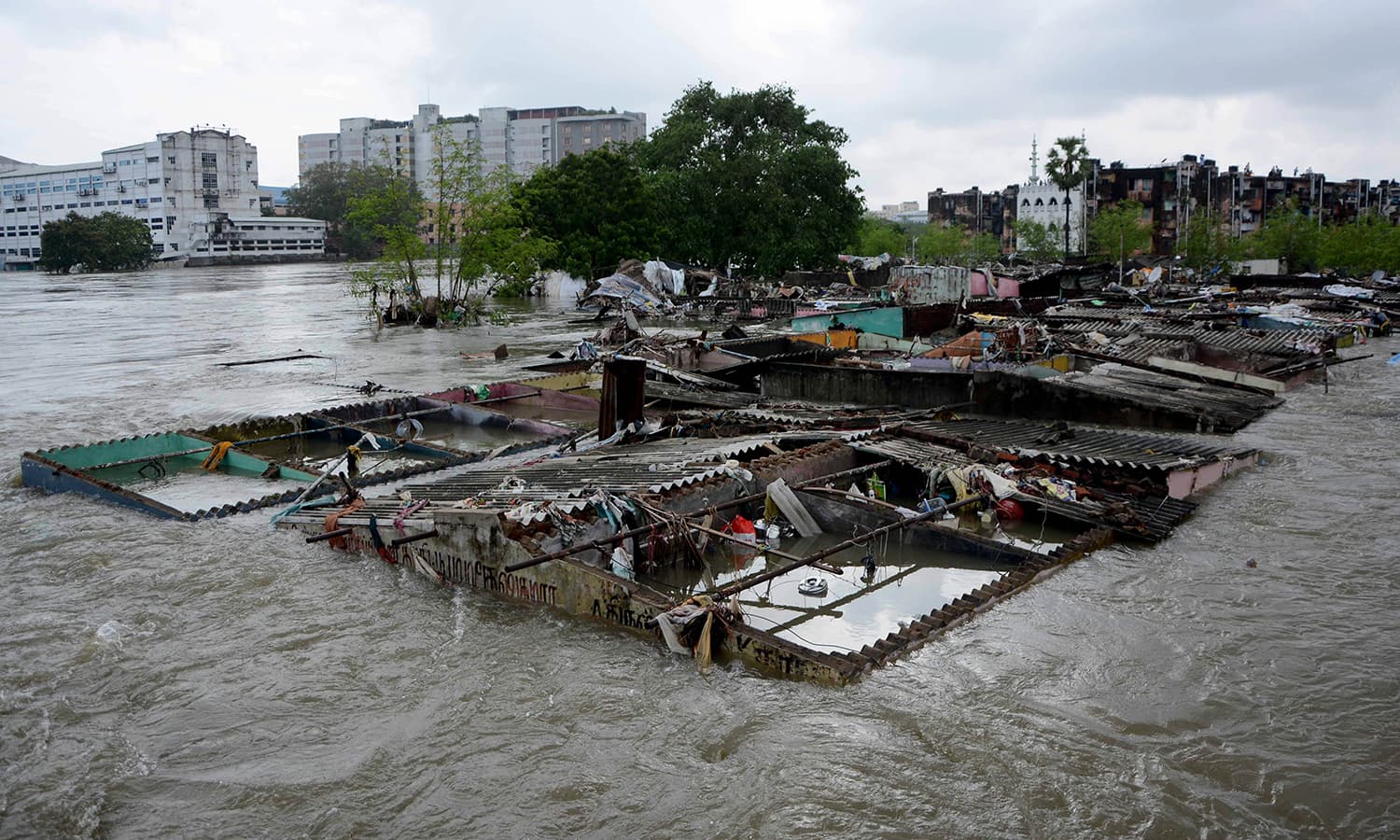 This general view shows buildings inundated by floodwaters in Chennai on December 3, 2015. — AFP