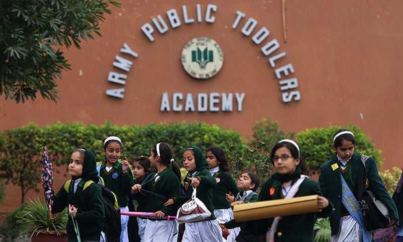 Students leave APS, the scene of the Dec 16 massacre ─the deadliest terror attack in Pakistan's history. — AFP