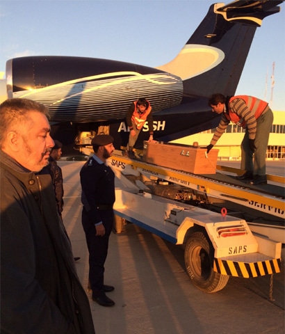 QUETTA: The coffin of Nawab Marri&rsquo;s widow being unloaded from a plane at the airport here.&mdash;Dawn