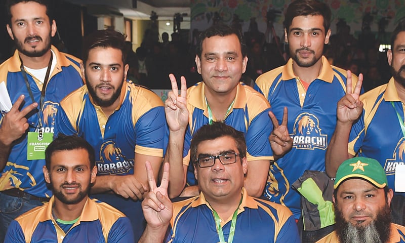 Players and officials of Karachi Kings seen in a light mood.—AFP