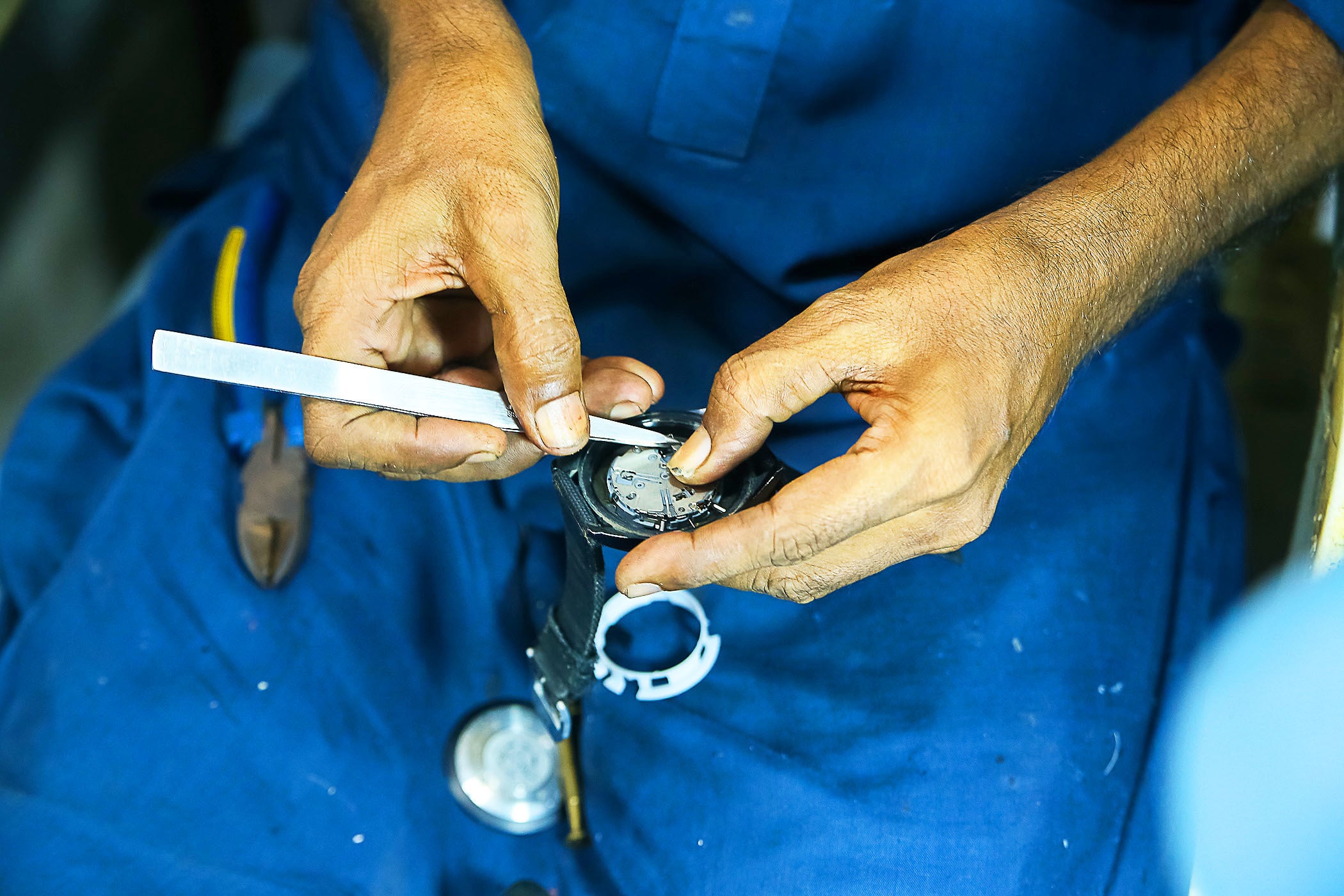 Shahid removes the damaged parts.