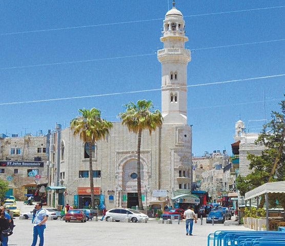 The Manger Square in Bethelam, where Christians gather to sing Christmas carols. A beautiful mosque with white minarets, named after Caliph Umar, stands as a sentinel to the square/Photo by Anjum Niaz
