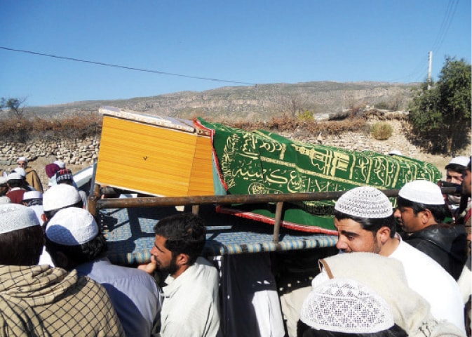 Mourners carry the coffin of a Charsadda attack victim in Karak on Thursday. &mdash; Online
