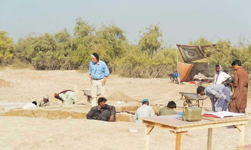 A French archaeology expert supervises excavation by labourers  at the Chahun Jo Daro site on Friday.—Dawn