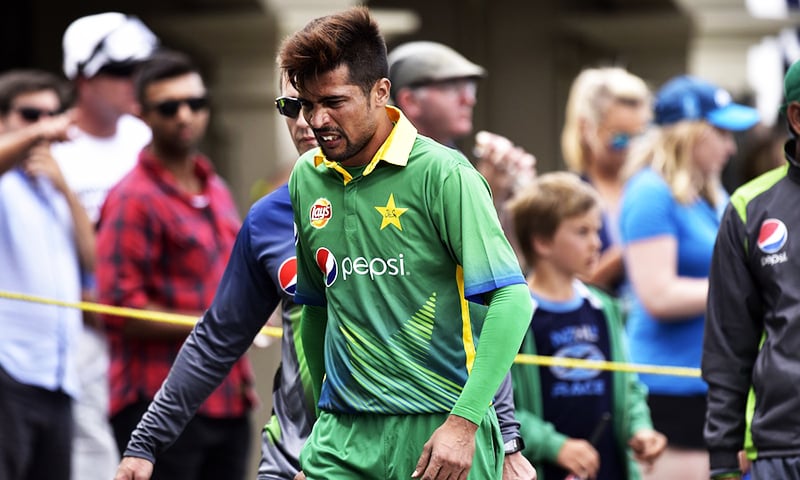 Amir walks from the field injured during the first ODI against New Zealand at the Basin Reserve in Wellington on January 25, 2016. — AFP