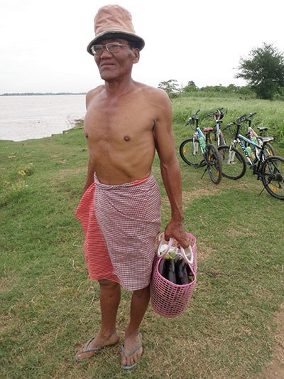 Dr Pomulla frolicking at an excavation site in Cambodia.