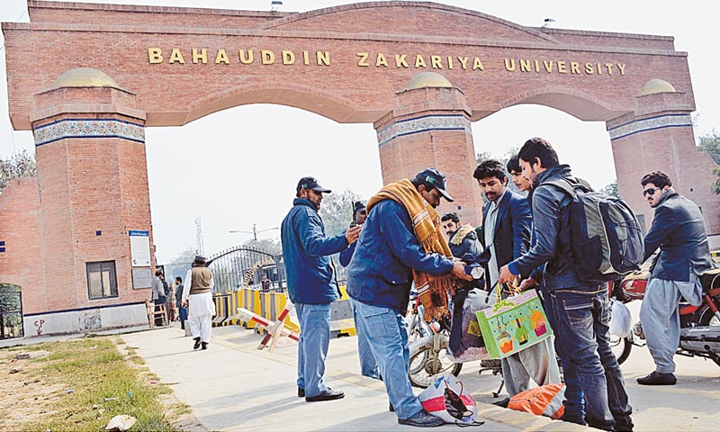 MULTAN: Security officials checking students at the entrance of the Bahauddin Zakariya University during a search operation on Thursday. The university was closed for two days because of security concerns. At least 11 people were arrested on Wednesday night during the operation.—APP