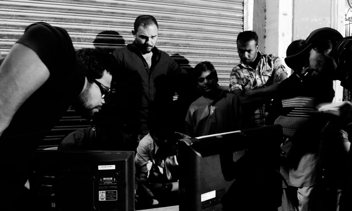 The crew of Moor watches the replay of a scene | Courtesy Azad Film Company