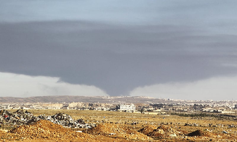 Smoke rises over the industrial city in Aleppo, Syria. -Reuters