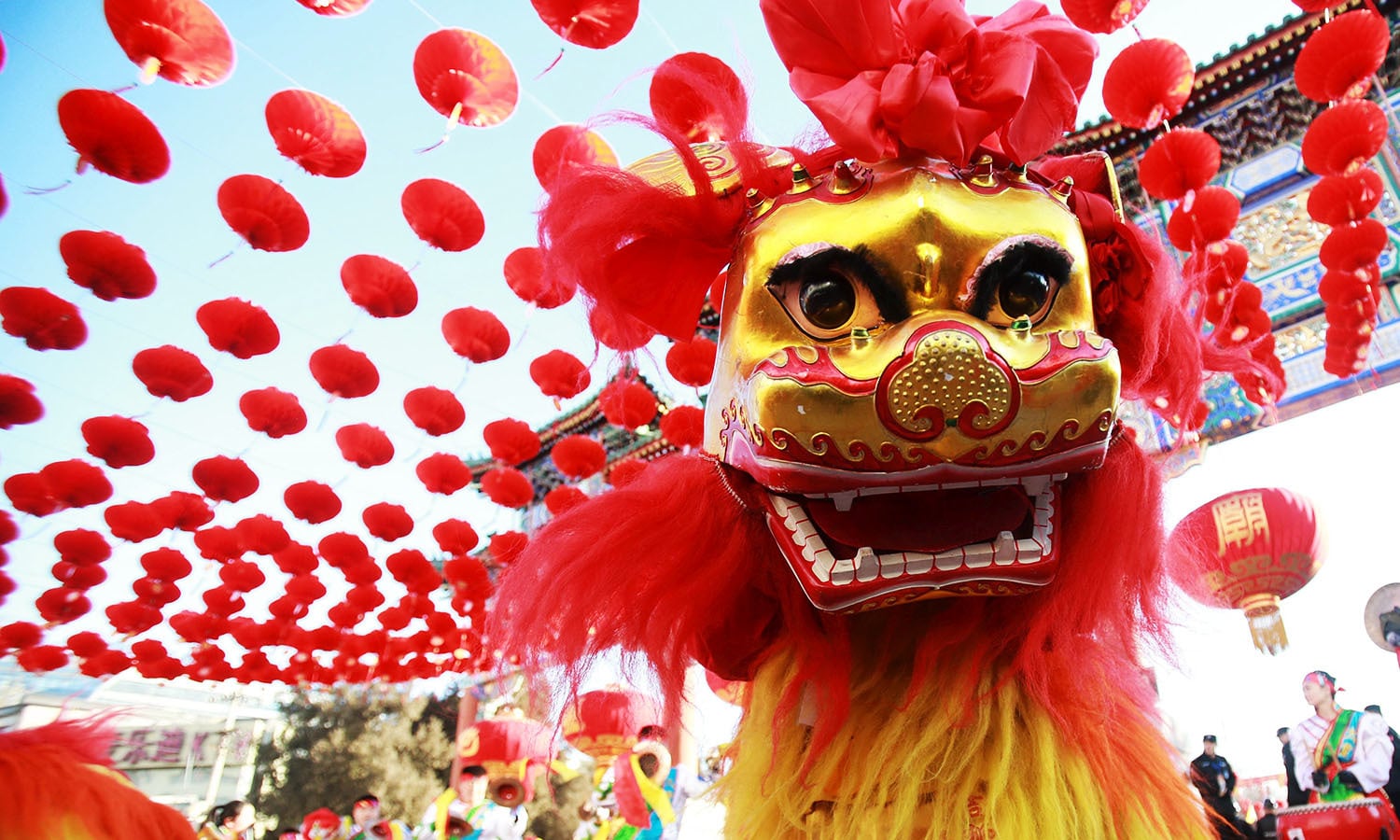 Traditional dancers perform the lion dance during the opening ceremony of a temple fair. ─ Reuters