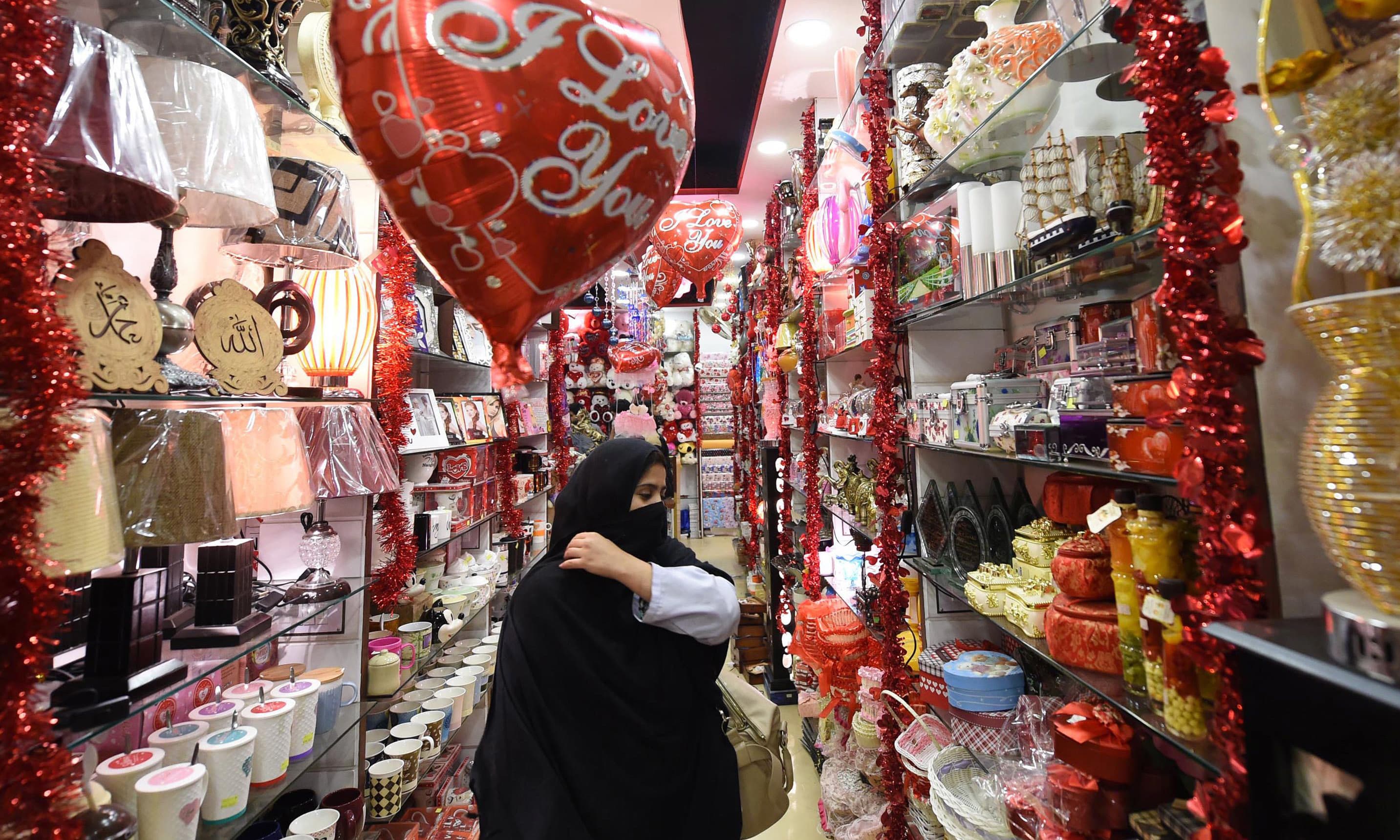 A woman visits a gift shop in Peshawar ahead of Valentine's Day. —AFP